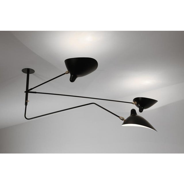 Ceiling lamp model "suspension" 'two fixed and one rotating curved arm ceiling lamp' designed by serge mouille in 1956....