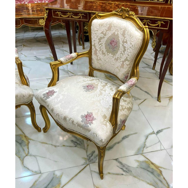 Bring timeless French elegance to your interior with this beautifully crafted armchair, featuring an ornate carved wood...