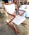 This solid teak, Danish modern rocking chair was designed by Benny Linden. It's original cream and beige upholstery is in...