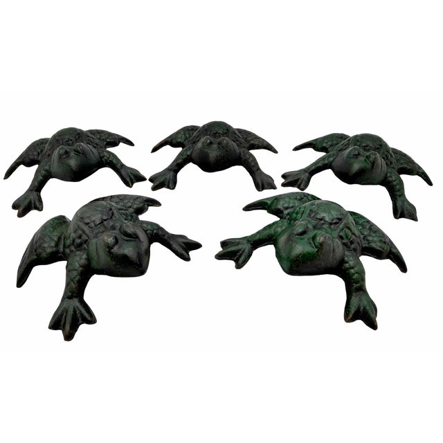A charming set of five cast iron frog figures, beautifully modeled with expressive features and textured bodies. Each frog...