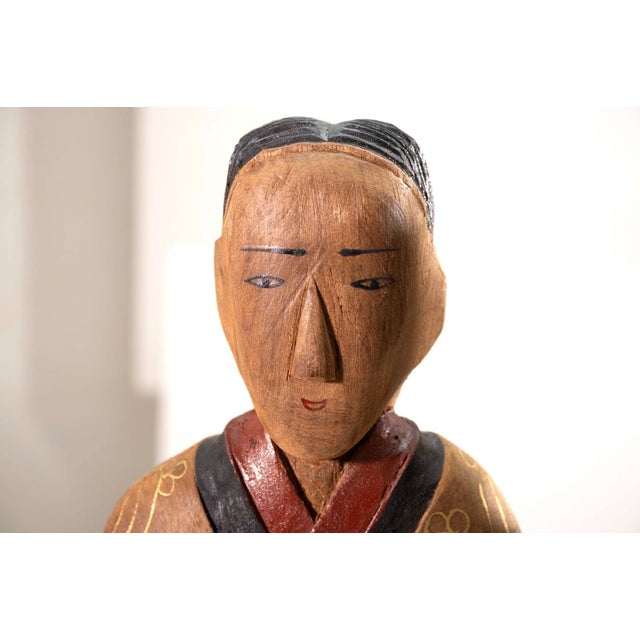 A pair of vintage Chinese wood figurine sculptures. Hand painted lacquer details. A collector’s item from the Shanghai...