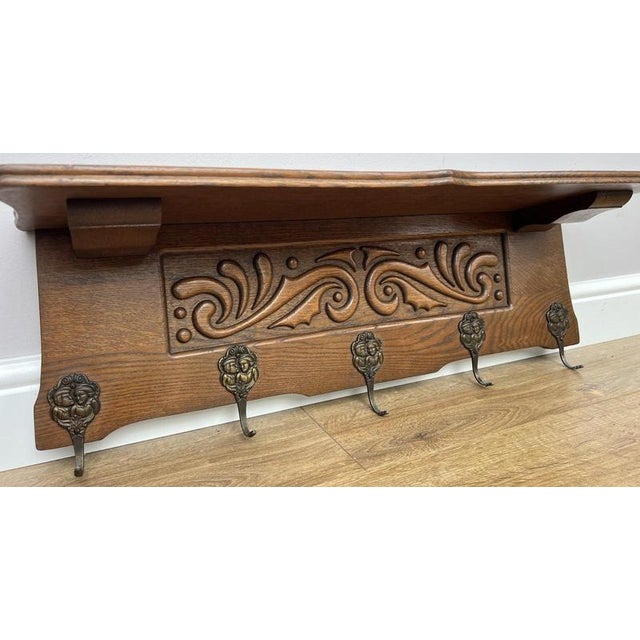 Add timeless French style to your hallway with this Vintage French coat hanger , featuring an elegant carved decorative...