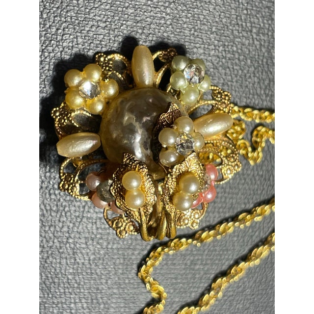 Intricate, multidimensional floral constructed pendant by Robert DeMario, inspired heavily by Haskell, whome he briefly...