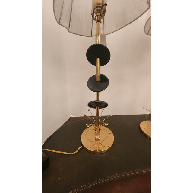 This listing features a pair of Mid-Century Rembrandt table lamps that are very modern style with a brass base and black...