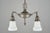 Victorian style pendant light made of brass with white cast glass shades. The chain is made of steel. This requires two...