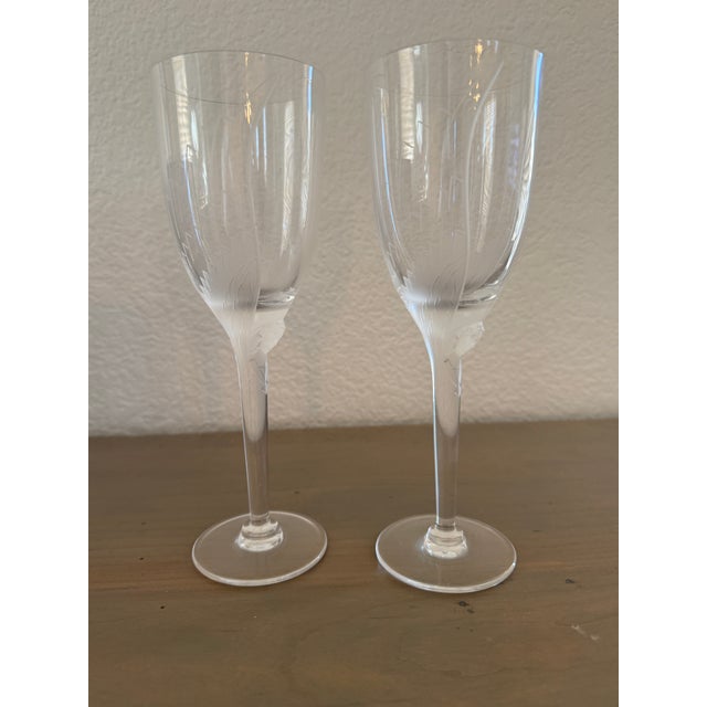 A rare find — and rarer still with its original packaging intact. This is a beautifully matched pair of vintage Lalique...