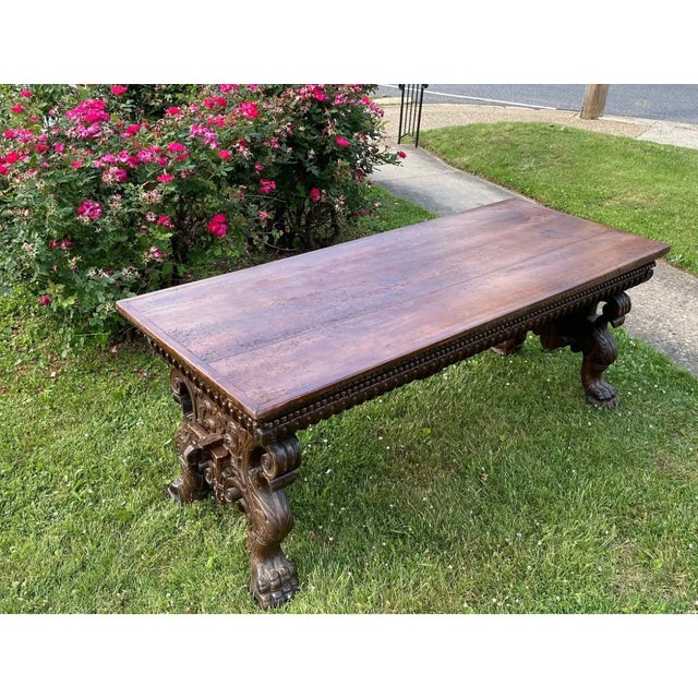 Incredible 17th-early 18th century Italian Baroque walnut trestle table from Tuscany. Hand-carved throughout, this table...