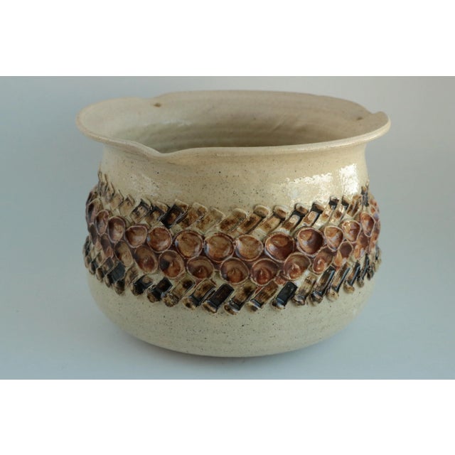 Dated 1974, this studio pottery hanging planter would happily host a small spider plant or pilea peperomioides. It has a...