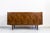 This vintage sideboard was manufactured in the 1970s by Łódzkie Fabryki Mebli in Poland. The structure is supported by...