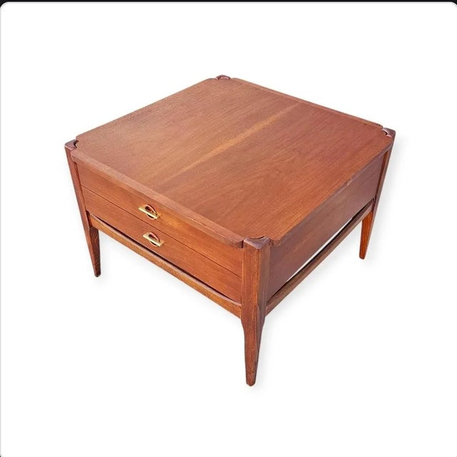 Mid-Century Modern Walnut end table with storage Drawer by Bassett furniture. This elegant vintage walnut end table from...