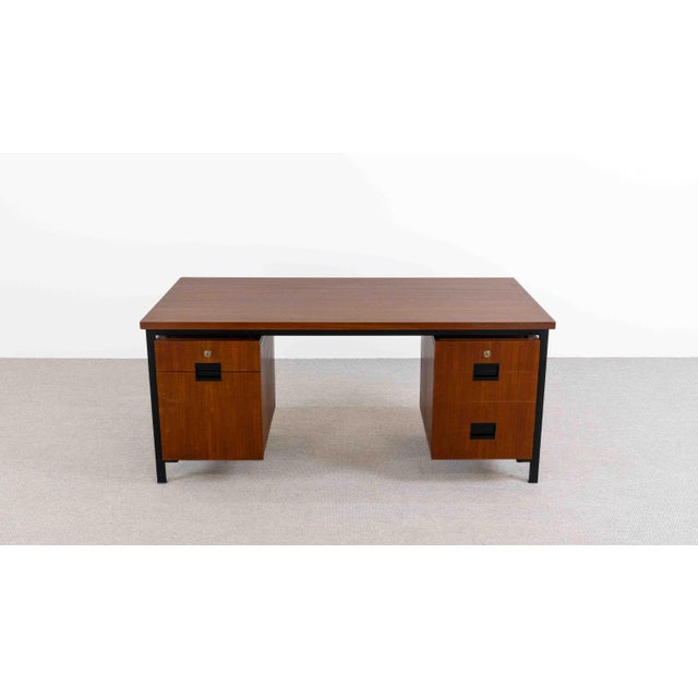 Teak desk from the 1950s, designed by Cees Braakman and manufactured by Pastoe, Netherlands. Blackened steel frame with...