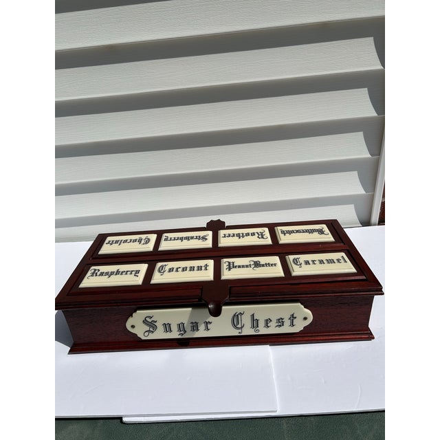 This is a modern twist on a sugar chest. It appears to be made of oak that is stained a deep reddish brown color. It...