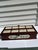 This is a modern twist on a sugar chest. It appears to be made of oak that is stained a deep reddish brown color. It...