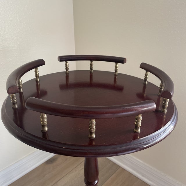 Elegant vintage mahogany side table featuring classic Chippendale-inspired styling with a versatile design suitable as a...