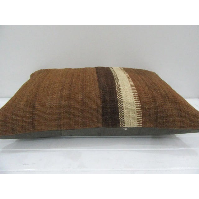 This is a pillow cover made from a vintage kilim rug. The piece was properly washed and ready to use. Pillow inserts not...