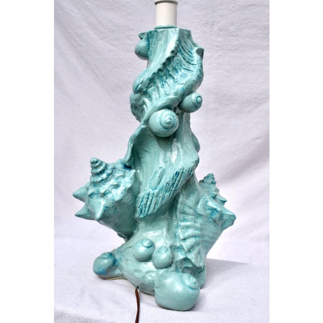 1970's molded glazed ceramic table lamp by Sirmos , in unusual Aqua blue. Height is 24" to top of socket, ready for use.