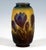 Tubular vase with an outwardly curved body resting on a stepped, inwardly drawn ring-shaped base, and a correspondingly...