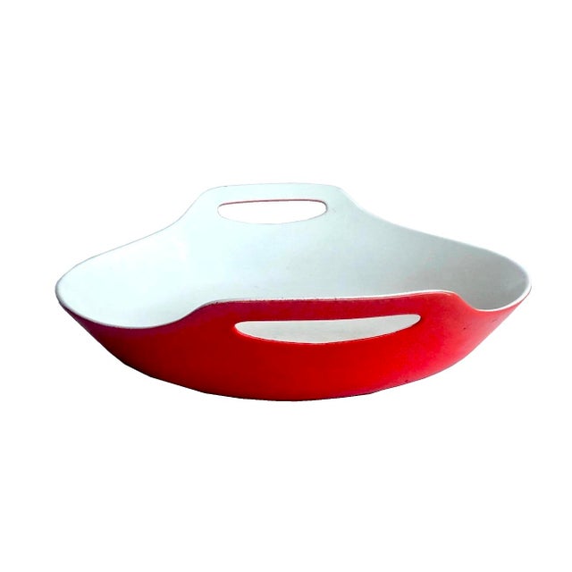 Offered is a mid 20th Century large red porcelain enamel on cast iron paella pan designed for Copco by Machel Lax and made...