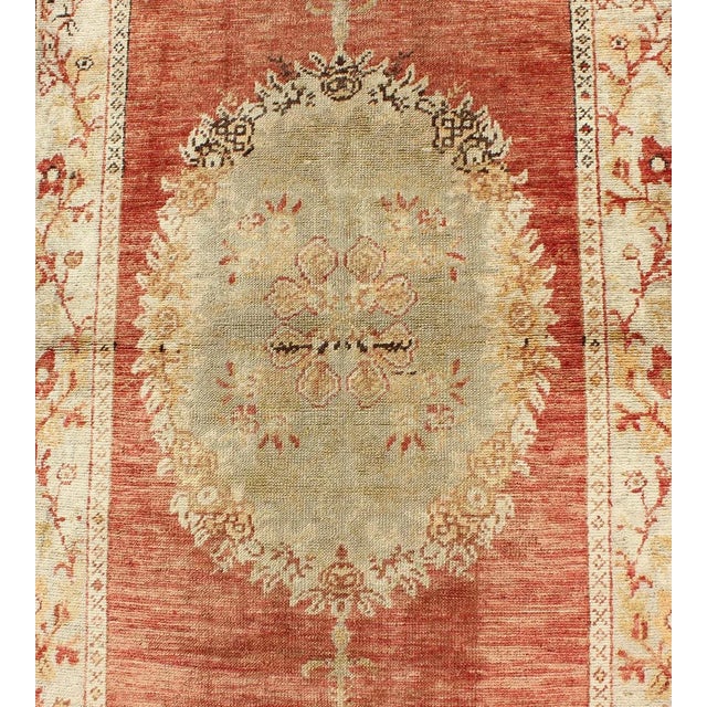 Mid 20th Century Turkish Oushak Runner With Floral Medallions in Soft Orange Red, Olive Green and Cream For Sale - Image 5 of 7