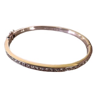 Givenchy Rose Gold-Tone Bangle Bracelet Featuring a Row of Inlaid Crystals and a Hinged Clasp. For Sale