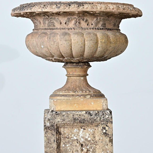 A carved stone planter rests upon a pedestal to create a lovely garden accent. Made in England in the 19th Century, the...