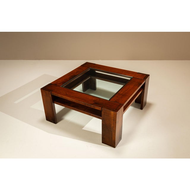 A restrained composition of timber and glass, where proportion and material carry the narrative. This table reflects a...