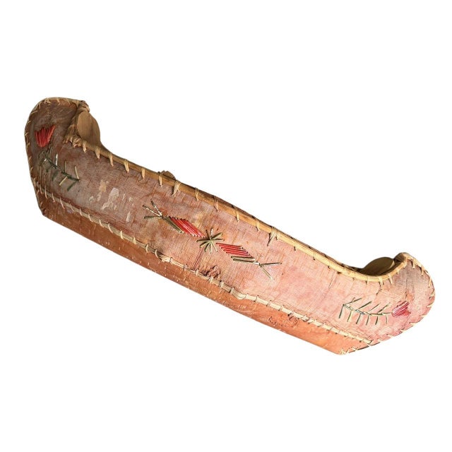 A 1900s birch bark canoe model with beautiful quillwork grass design — no breaks in the canoe, some fading of color in...