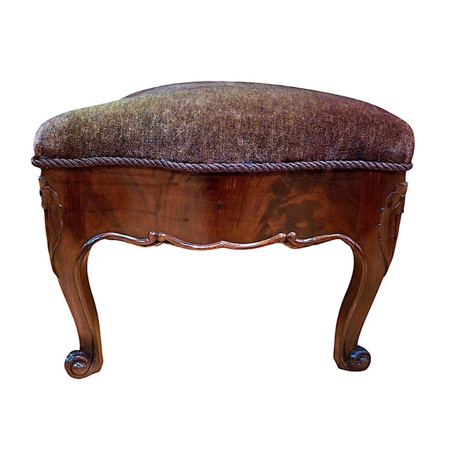 This 19th-century French bench, crafted by hand in the Louis XV style, features flowing curves such as the serpentine-...