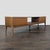 Engineered wood with a white ceramic top with veining. It includes two spacious storage drawers and an open center shelf....