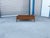 This mid-century modern walnut coffee table by Lane combines sleek, sculptural design with clever functionality. Crafted...