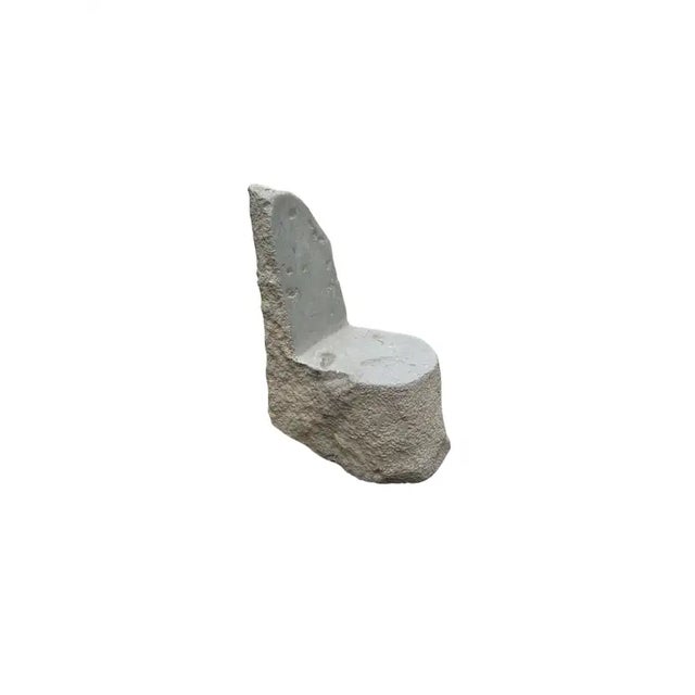 A incredibly heavy and solid stone chair. This lovely sculptural object was crafted from a solid stone sourced from a...