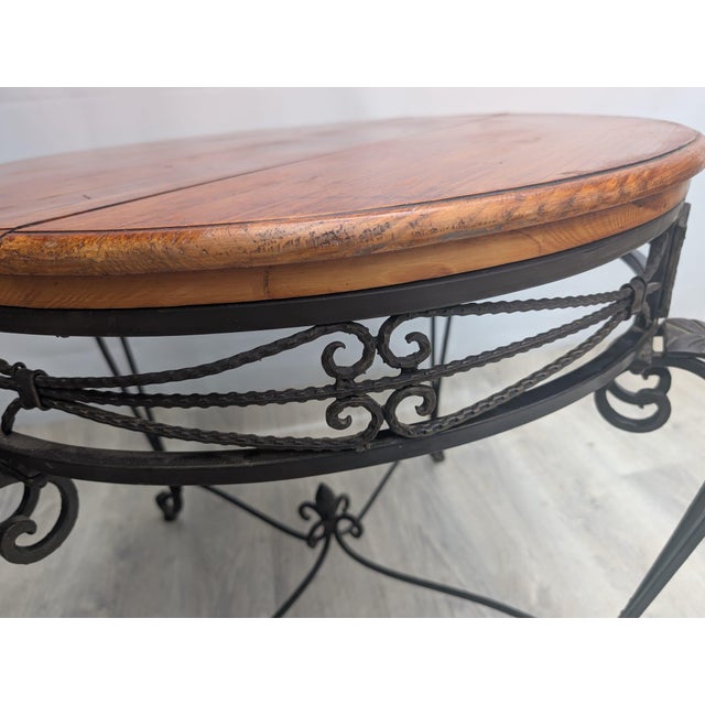 A forged metalwork table in a retro style. The table is made of forged steel, also known as metalwork. The tabletop is...