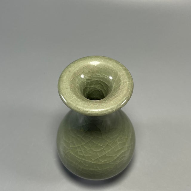 Beautiful antique Longquan celadon vase with natural crackle glaze. Elegant classic shape, traditional handmade ceramic...