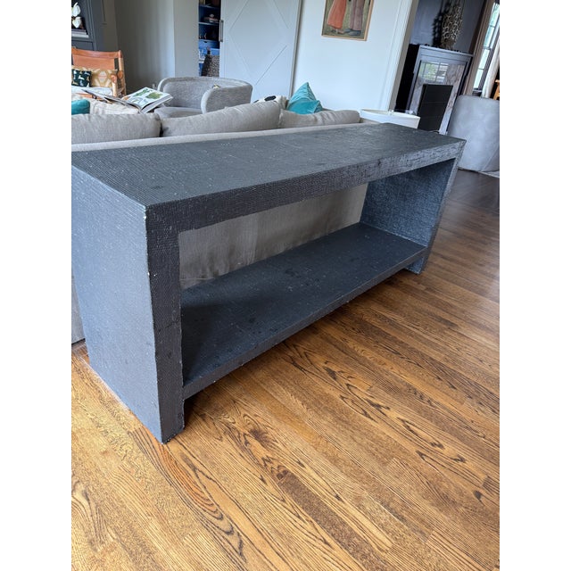 Structured console table wrapped in grasscloth and thickly painted in an “almost black” finish. Usable immediately but...
