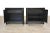 A pair of mid century modern rosewood front nightstands with black cases and chrome accents. 26” wide. 16” deep. 24.25” tall.