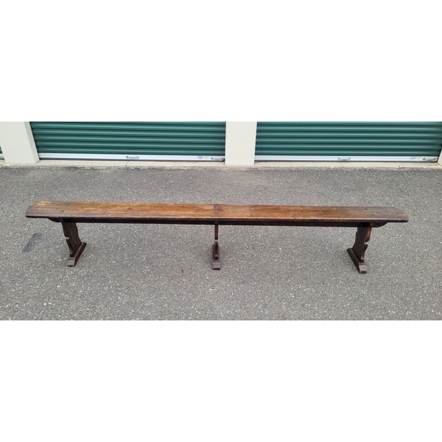 Very long measuring almost 10 ft is this vintage 1940s refractory Trestle bench. Features dovetailed legs molding like...
