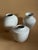 A rare triptych of white glazed porcelain vases dating back to 1925-1970 in berlin. the set consists of: two elegant and...
