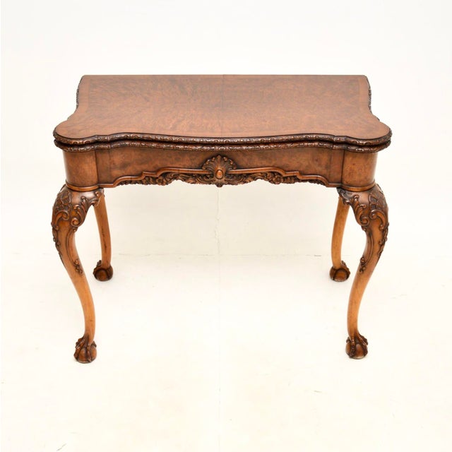 A fantastic antique burr walnut card table of the highest order. This was made in England, it dates from around the...