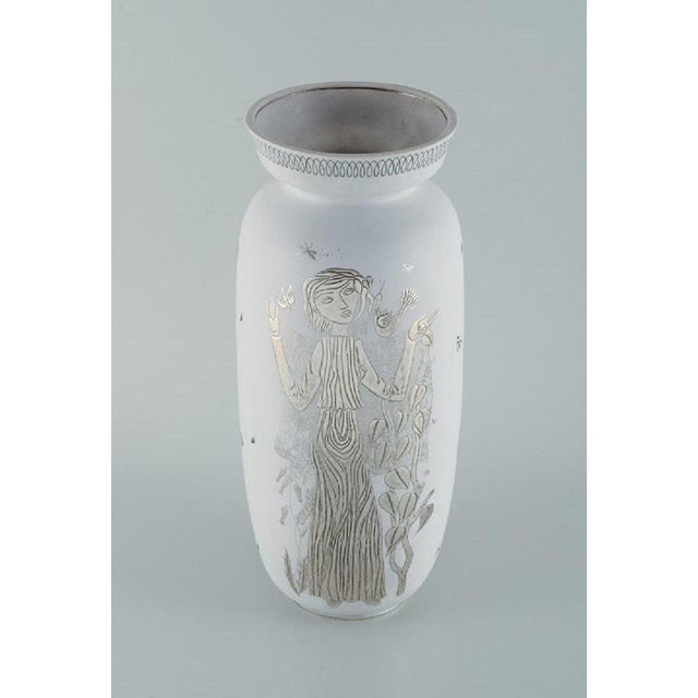 Stig Lindberg for Gustavsberg, Sweden. Large "Grazia" ceramic vase with silver inlay in the shape of a standing woman....