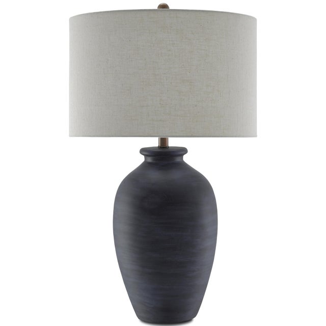 The darkly handsome Cyanic Table Lamp is a stand-out with its scarab blue glaze and generously-scaled rotundness. The...