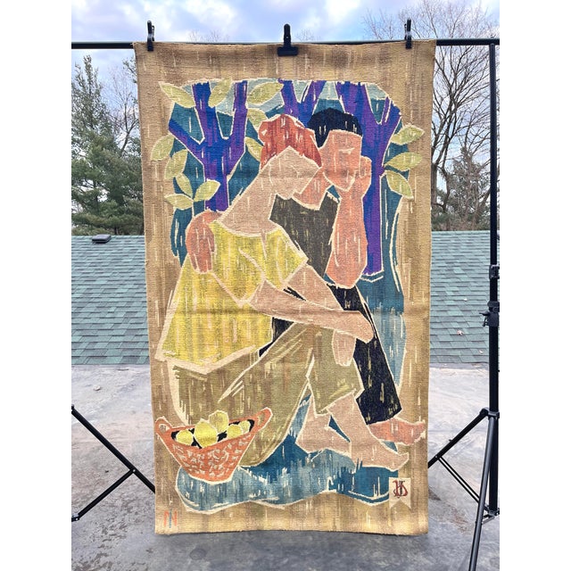 A commanding 80-inch tall vintage woven tapestry depicting a stylized couple in a vibrant orchard setting, with a palette...