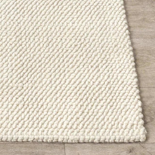 Soft wool-jute blend rug in a beautiful light ivory color. Available in numerous sizes. Please note that its appearance...