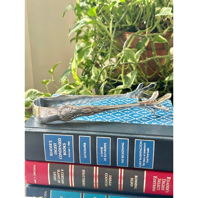 Add a bit of old world elegance to your entertaining with these silver plate ice tongs. From Reed and Barton, the pattern...