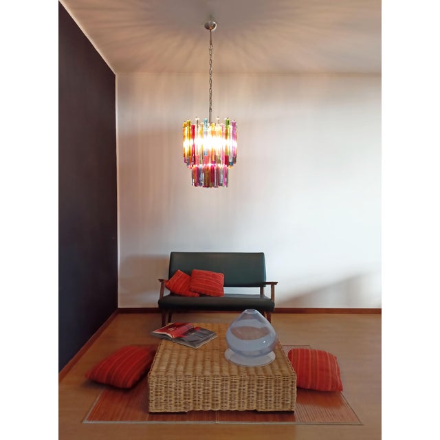 Fantastic vintage murano chandelier made by 107 murano crystal multicolored prism in a nickel metal frame. The glasses are...