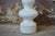 Large, made of white earthenware, and featuring lines reminiscent of a totem pole, this vase exudes vintage energy and...