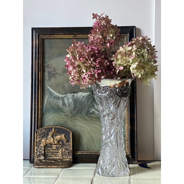 She's a stunner. This tall trumpet vase is cut in the deep, light-catching patterns of the American Brilliant period —...