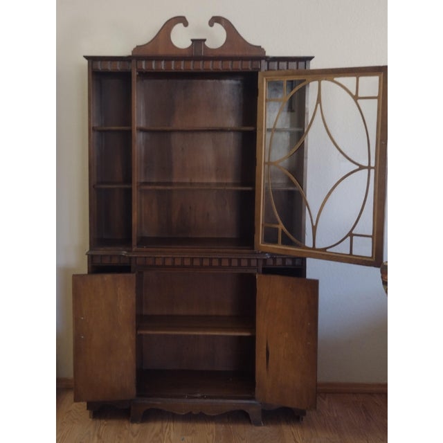This is a beautiful vintage china cabinet or hutch, likely from the early to mid-20th century, showcasing classic...