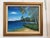 This beautiful oil on canvas painting depicts a serene tropical beach scene, featuring gently curving shoreline, crystal-...