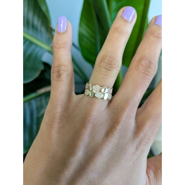 Forty-two earth-mined diamonds shimmer across this solid 14K rose gold band. The warm rose gold flatters the diamonds'...