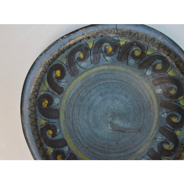 Charming small ceramic dish by Jean de Lespinasse, a notable figure in 20th-century French ceramics. This piece features a...